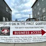 Sign pointing to the R. Stuart & Co Winery located in the Granary District of McMinnville