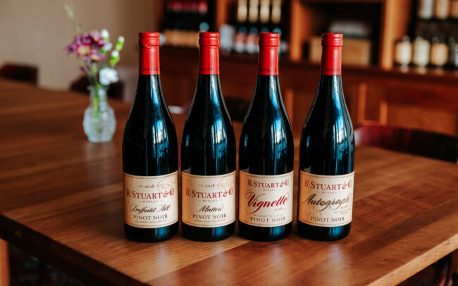 Lineup of four exclusive R. Stuart & Co wine bottles
